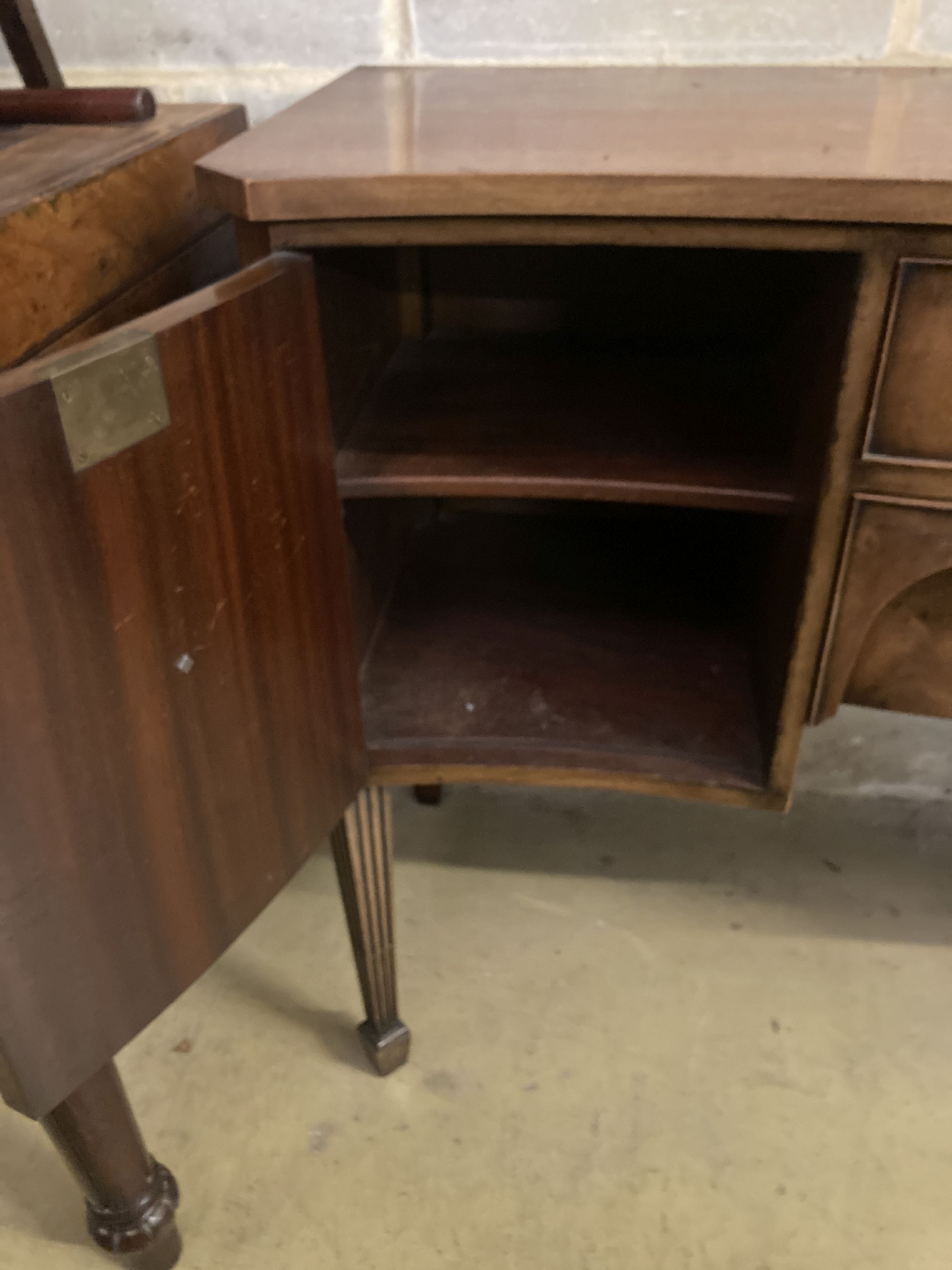 A George III style mahogany serpentine fronted sideboard, length 138cm, depth 52cm, height 92cm